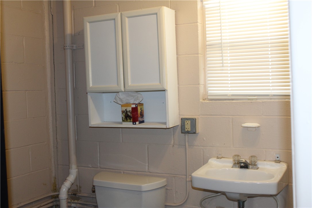 125 Lagarto Ferry Mathis, TX 78368 - Photo 31 of 38 a bathroom with a sink a toilet and tub