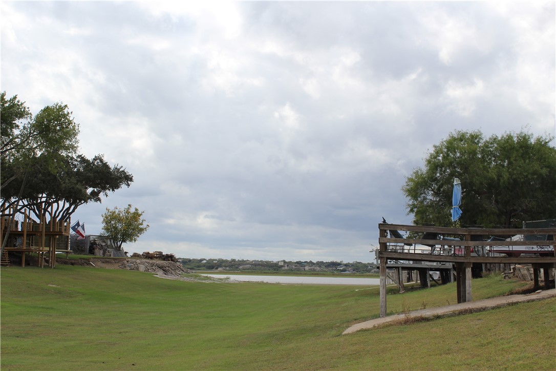 125 Lagarto Ferry Mathis, TX 78368 - Photo 36 of 38 a view of a lake with houses in the back
