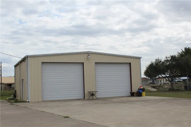 a view of garage and deck