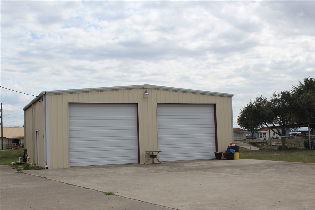 125 Lagarto Ferry Mathis, TX 78368 - Photo 4 of 38 a view of garage and deck