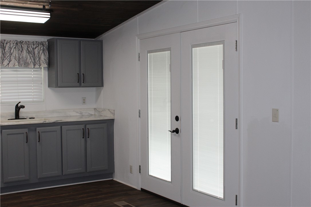 125 Lagarto Ferry Mathis, TX 78368 - Photo 8 of 38 a view of a kitchen from the hallway
