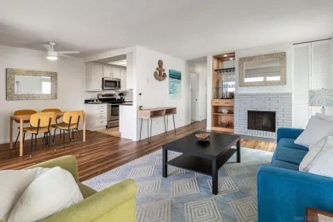 a view of a room with wooden floor and a window