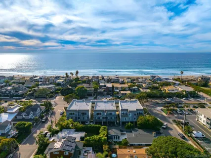 an aerial view of residential building with parking space
