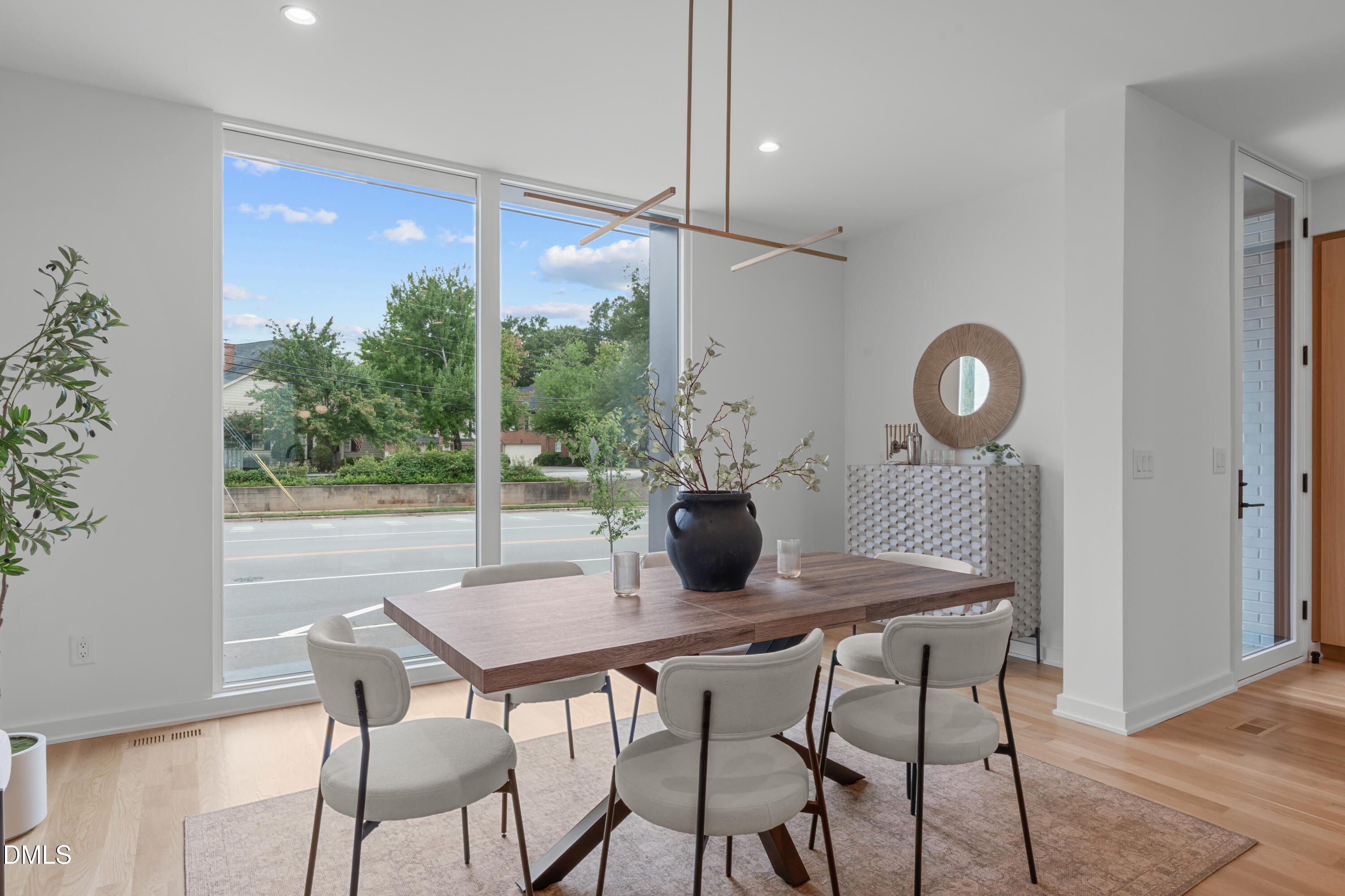 1307 Chamblee Hl Court Raleigh, NC 27608 - Photo 14 of 65 a view of a dining room with furniture window and wooden floor