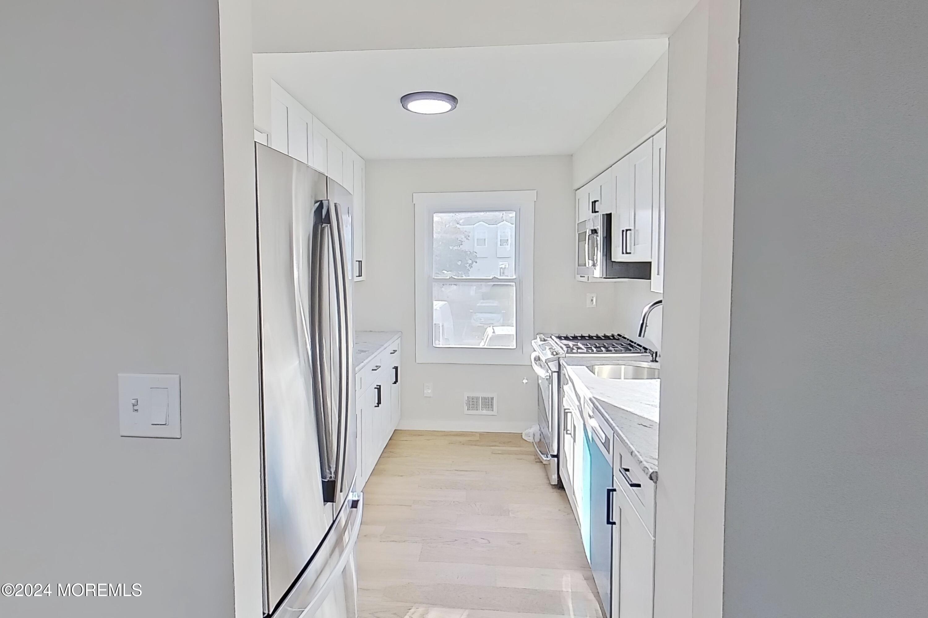 178 Sawmill Road, Unit 529 Brick, NJ 08724 - Photo 22 of 46 a room with a washer and dryer
