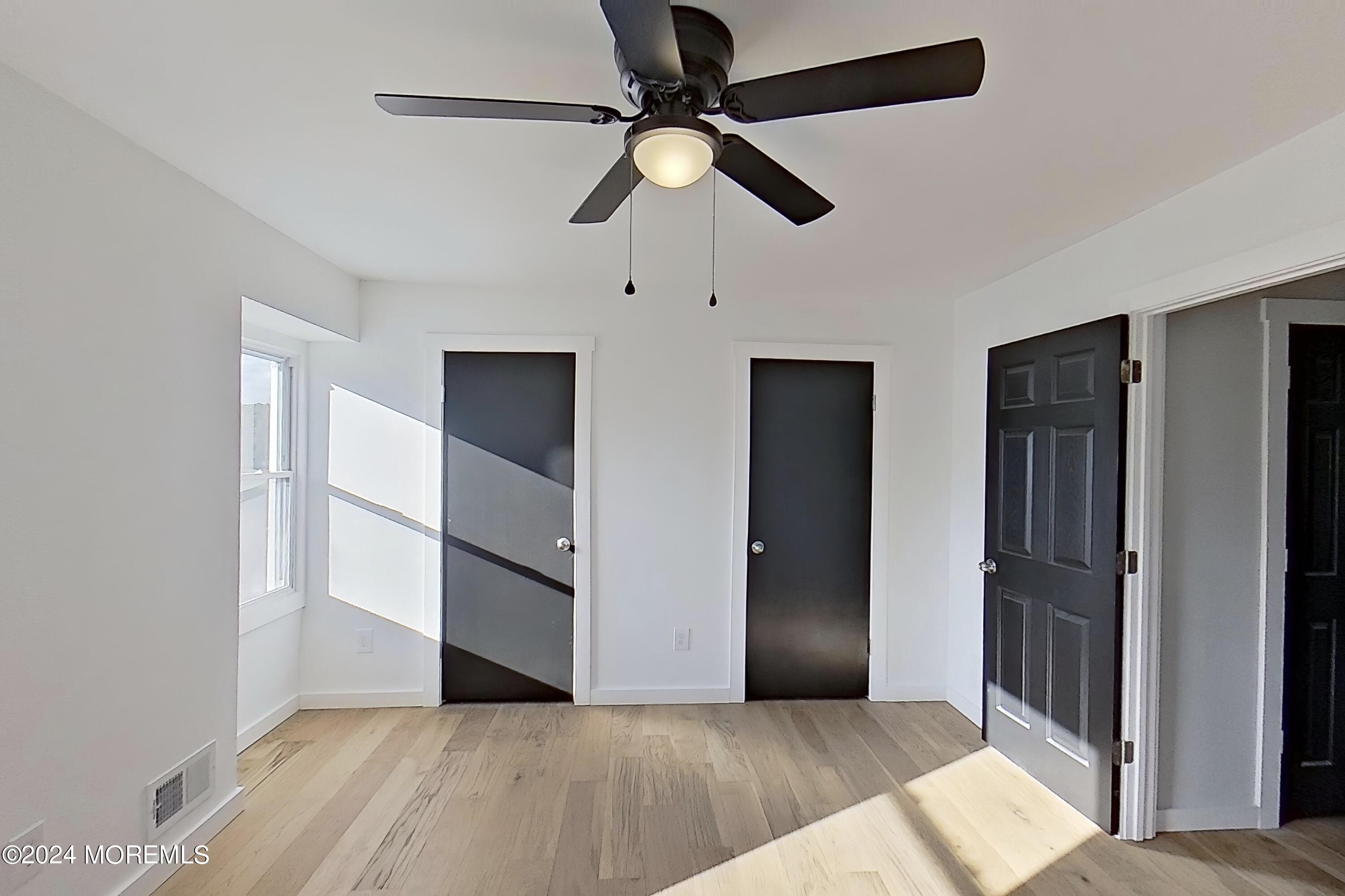 178 Sawmill Road, Unit 529 Brick, NJ 08724 - Photo 30 of 46 a view of an empty room with a ceiling fan