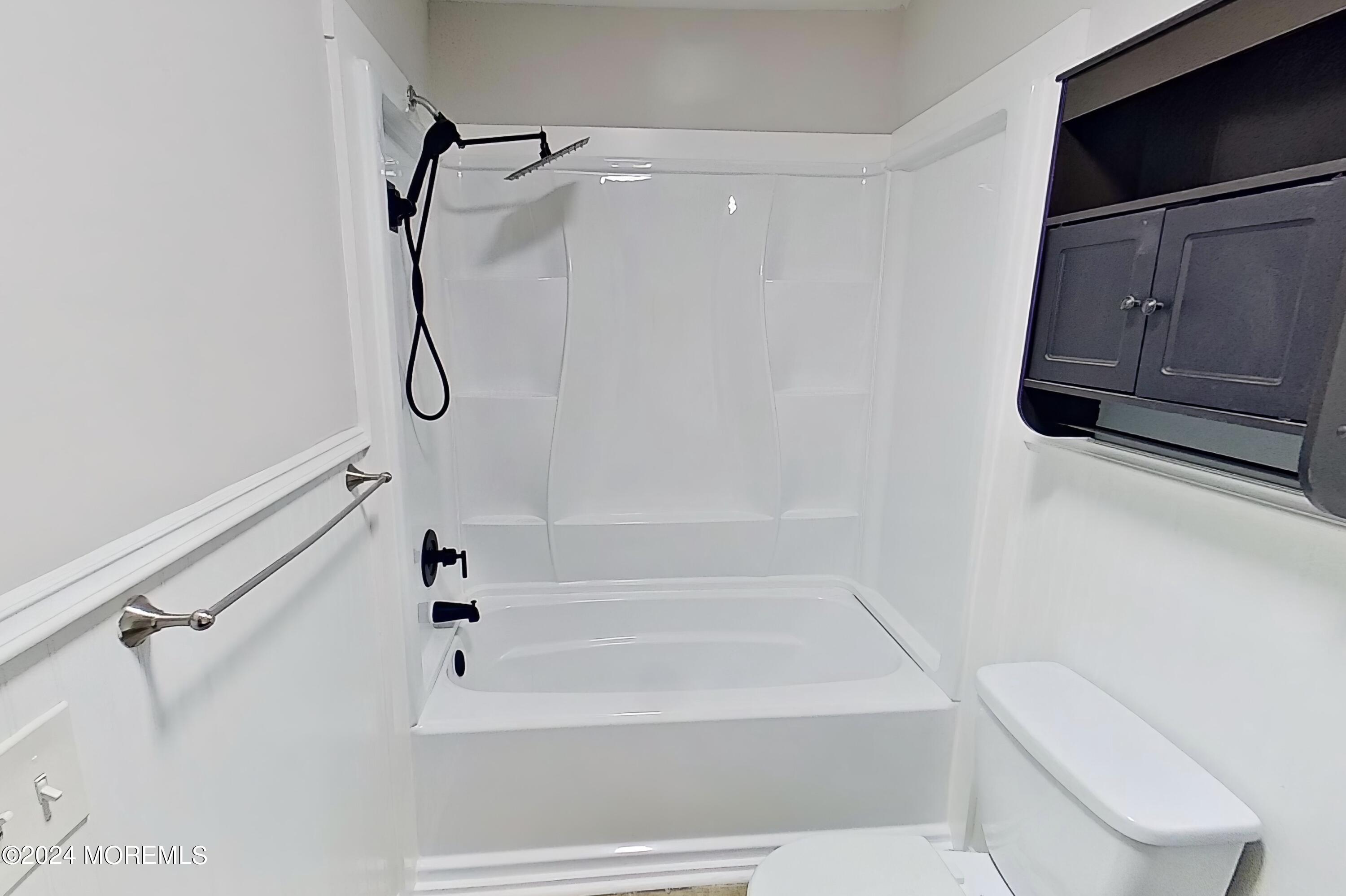 178 Sawmill Road, Unit 529 Brick, NJ 08724 - Photo 34 of 46 a bathroom with a shower a toilet and a shower