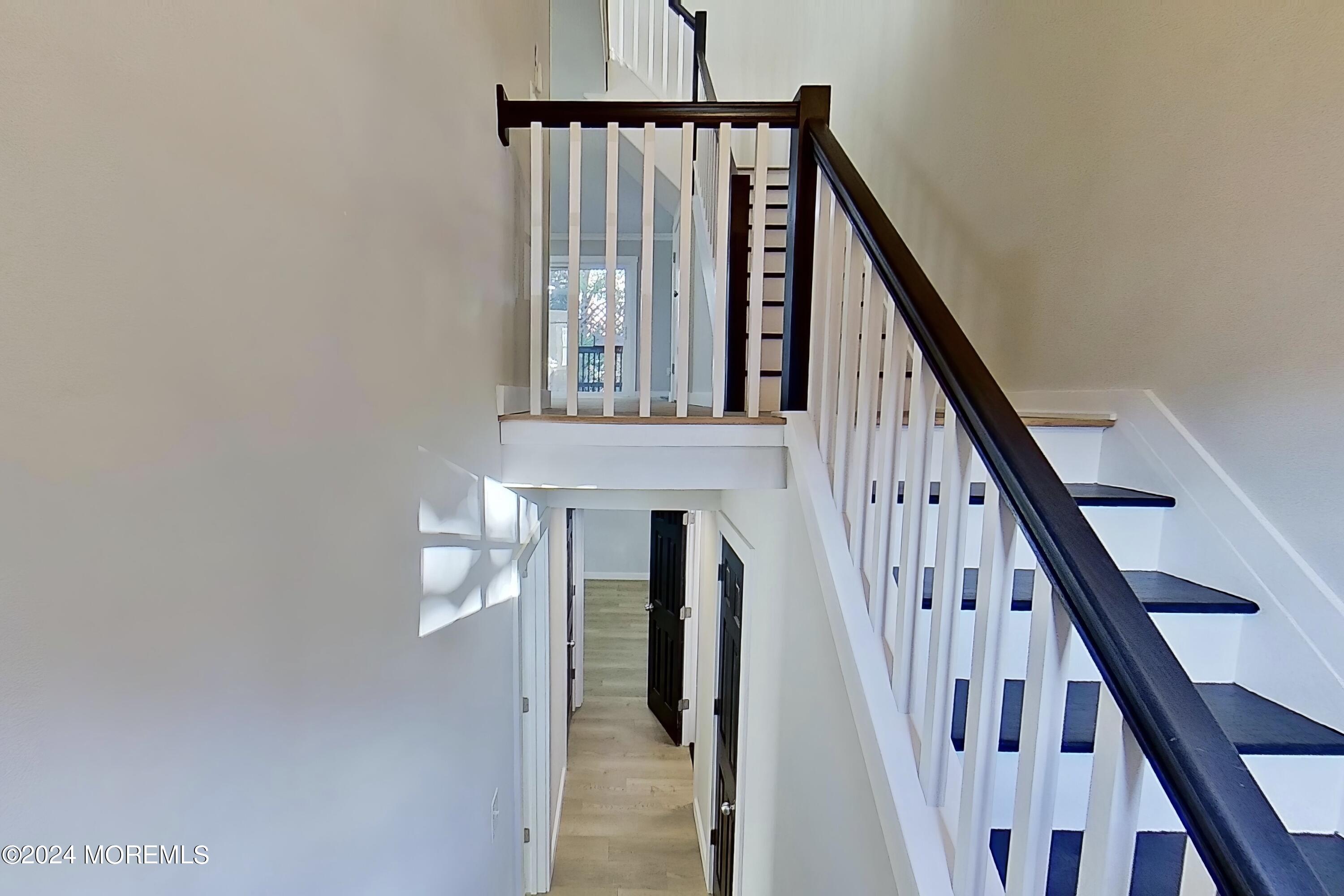 178 Sawmill Road, Unit 529 Brick, NJ 08724 - Photo 5 of 46 a view of staircase with railing and white walls
