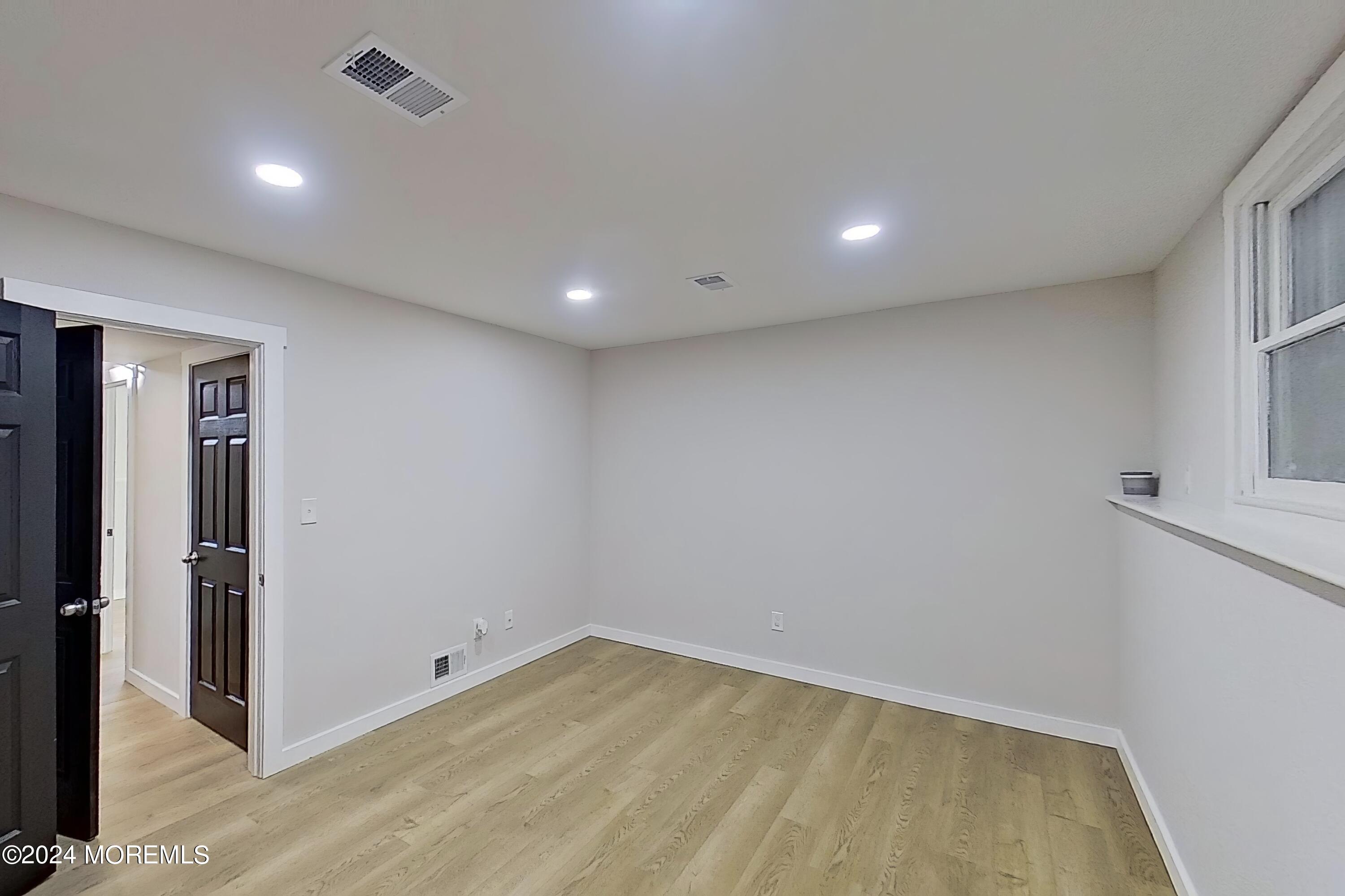 178 Sawmill Road, Unit 529 Brick, NJ 08724 - Photo 6 of 46 an empty room with a empty space and window