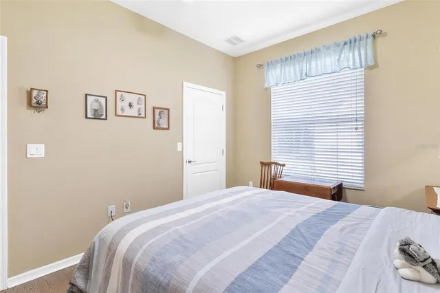 a view of a dining room with furniture and a chandelier