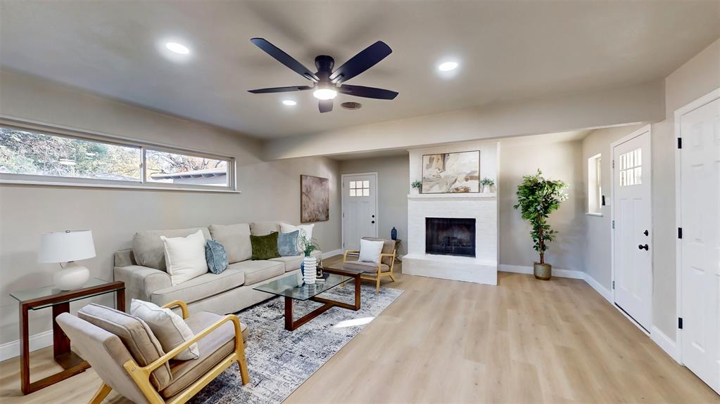 5009 Roxie Street Haltom City, TX 76117 - Photo 18 of 39 a living room with furniture and a fireplace