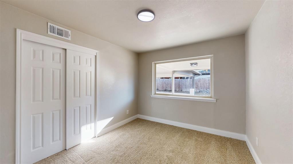 5009 Roxie Street Haltom City, TX 76117 - Photo 20 of 39 an empty room with windows