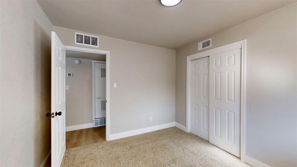 5009 Roxie Street Haltom City, TX 76117 - Photo 21 of 39 an empty room with closet