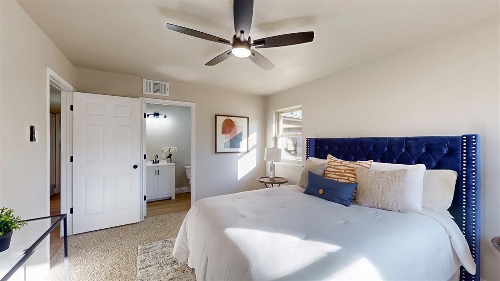 5009 Roxie Street Haltom City, TX 76117 - Photo 28 of 39 a bedroom with bed and window