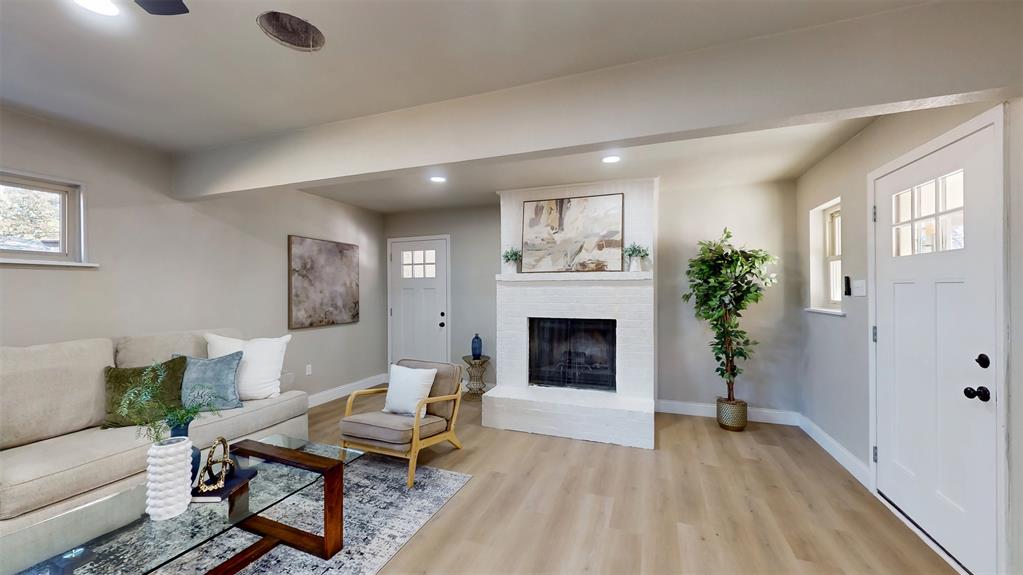 5009 Roxie Street Haltom City, TX 76117 - Photo 9 of 39 a living room with furniture and a fireplace