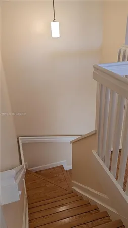 a view of balcony with wooden floor