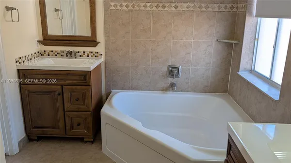 a bathroom with a sink and a bathtub