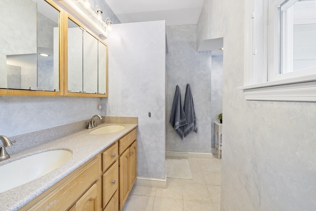 7 Longfellow Road Lexington, MA 02420 - Photo 17 of 30 a bathroom with a sink and a mirror