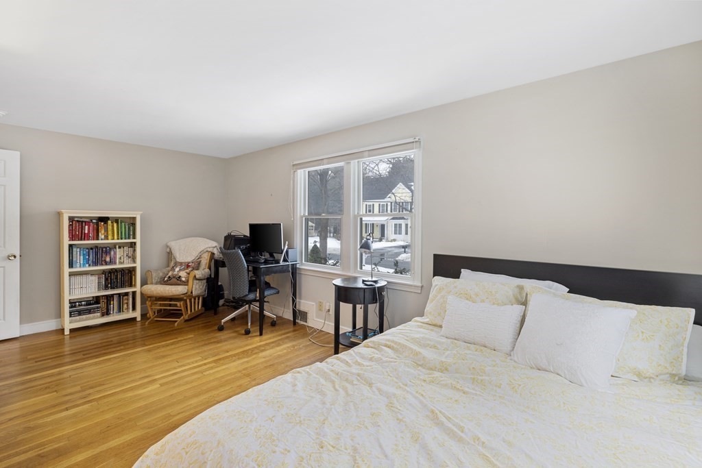 7 Longfellow Road Lexington, MA 02420 - Photo 20 of 30 a bedroom with a bed and wooden floor