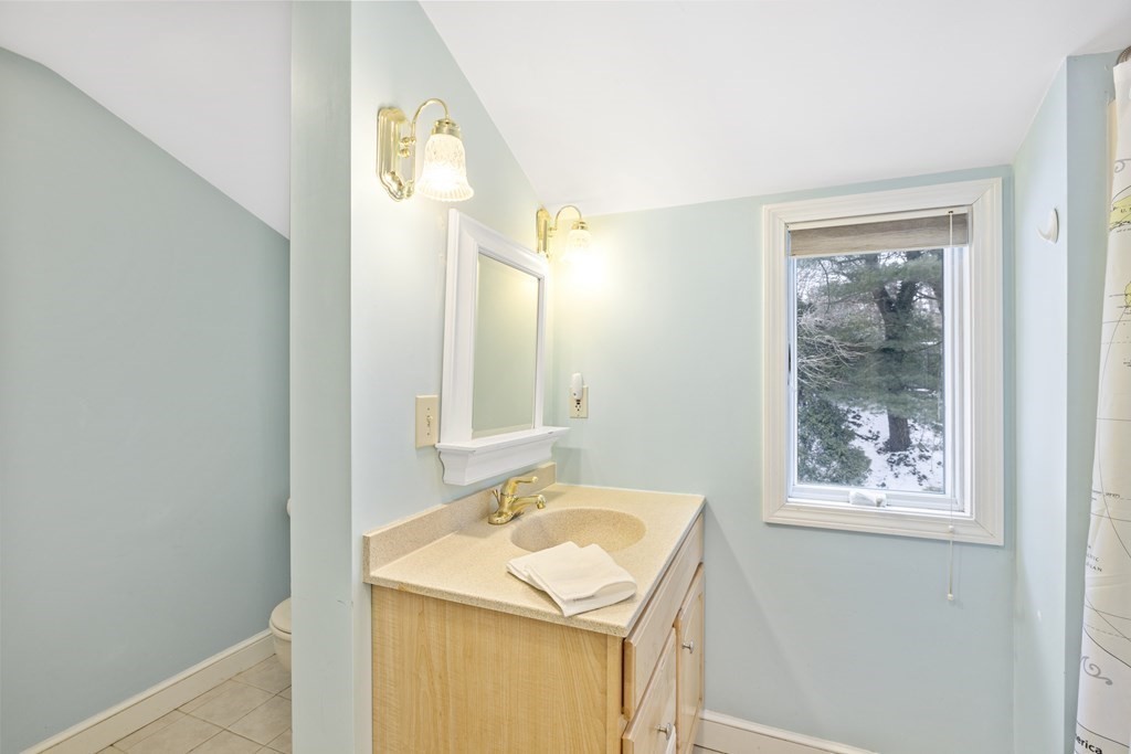 7 Longfellow Road Lexington, MA 02420 - Photo 25 of 30 a bathroom with a sink and a mirror
