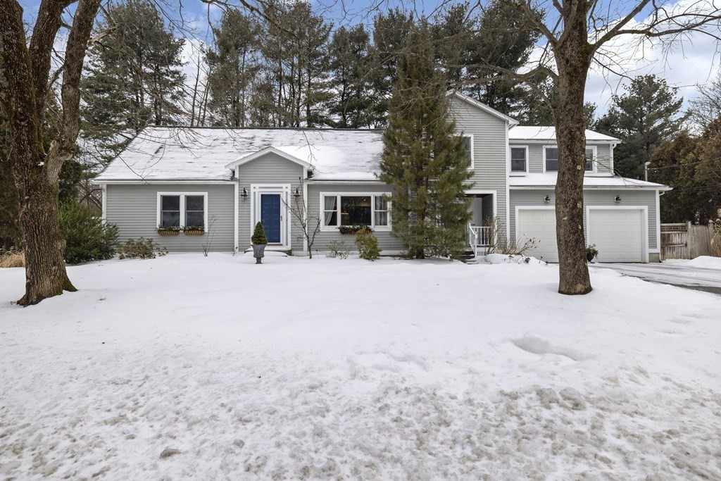 7 Longfellow Road Lexington, MA 02420 - Photo 28 of 30 a front view of a house with a yard covered in snow