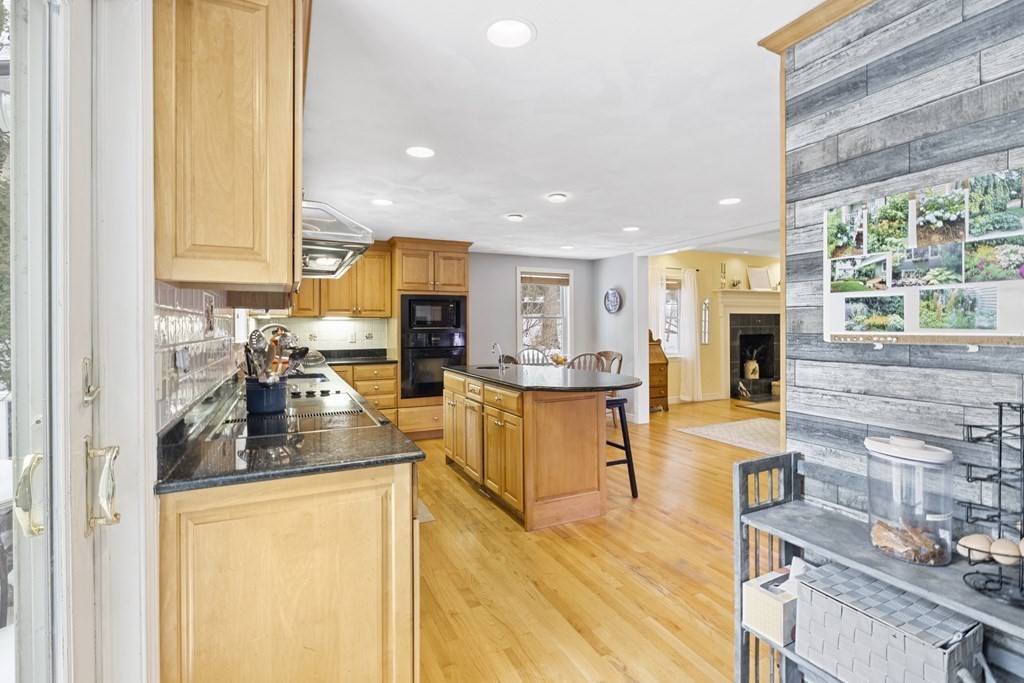 7 Longfellow Road Lexington, MA 02420 - Photo 3 of 30 a kitchen with stainless steel appliances granite countertop sink stove refrigerator and cabinets