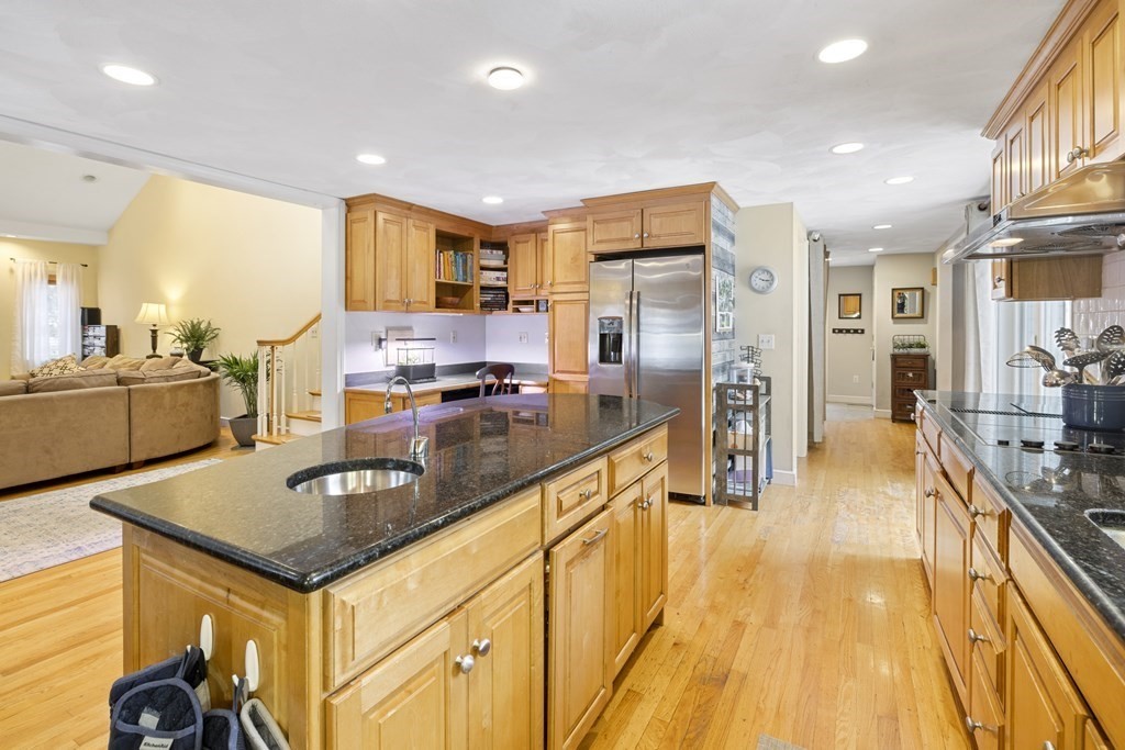 7 Longfellow Road Lexington, MA 02420 - Photo 4 of 30 a kitchen with stainless steel appliances granite countertop a sink stove and refrigerator