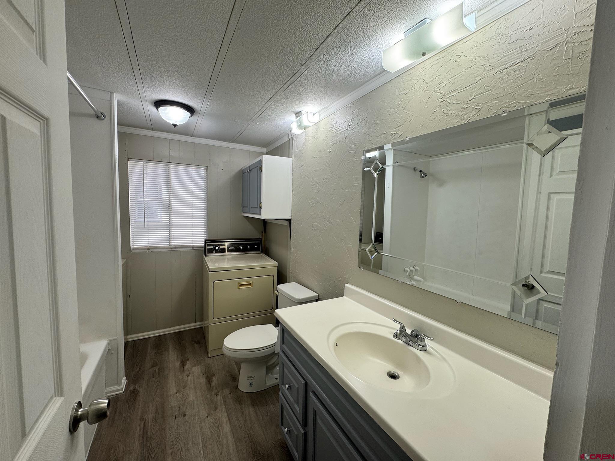 14555 Marine Road, Unit 328 Montrose, CO 81403 - Photo 14 of 20 a bathroom with a sink a toilet and shower