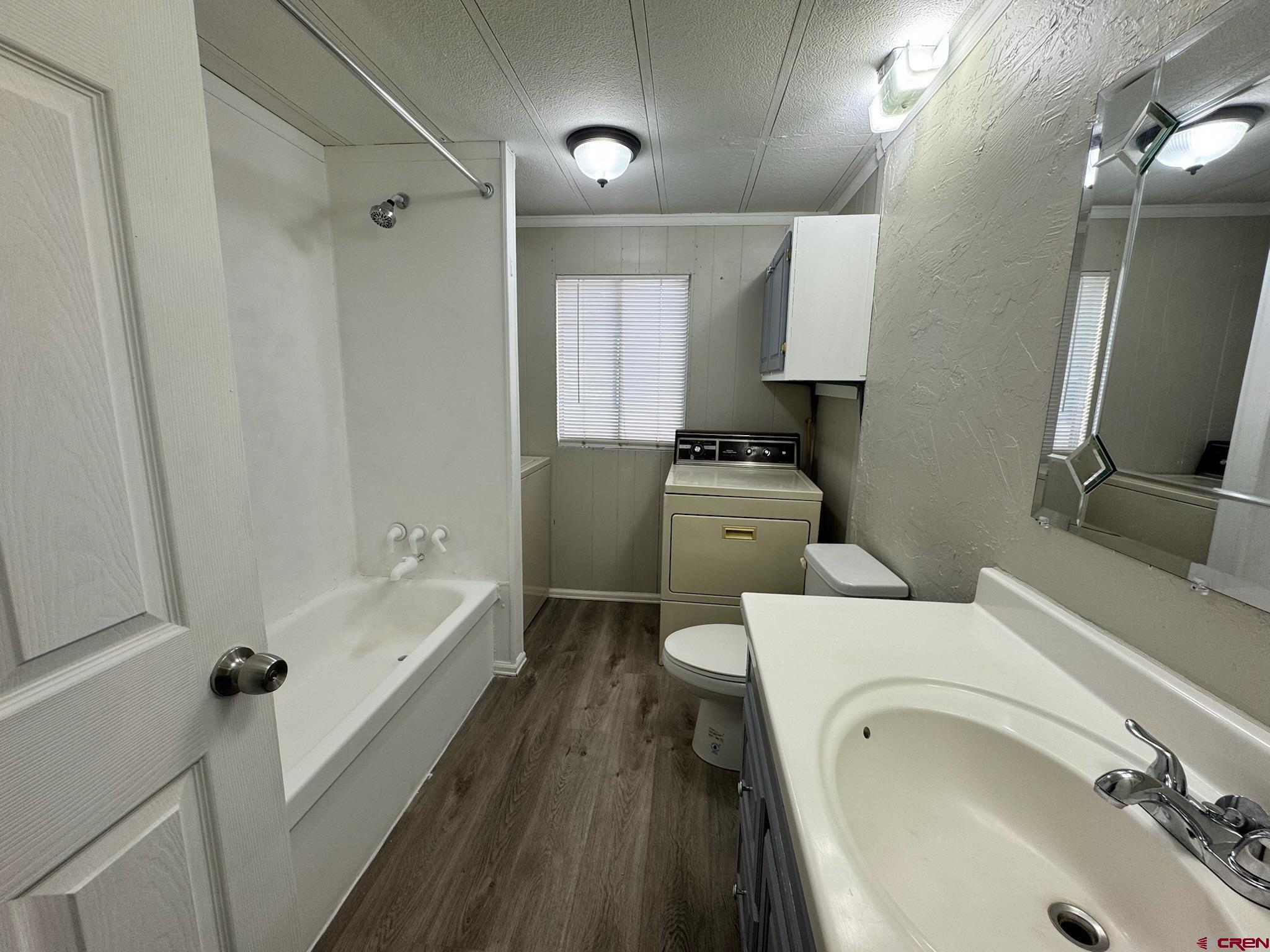 14555 Marine Road, Unit 328 Montrose, CO 81403 - Photo 15 of 20 a bathroom with a sink a toilet and bathtub