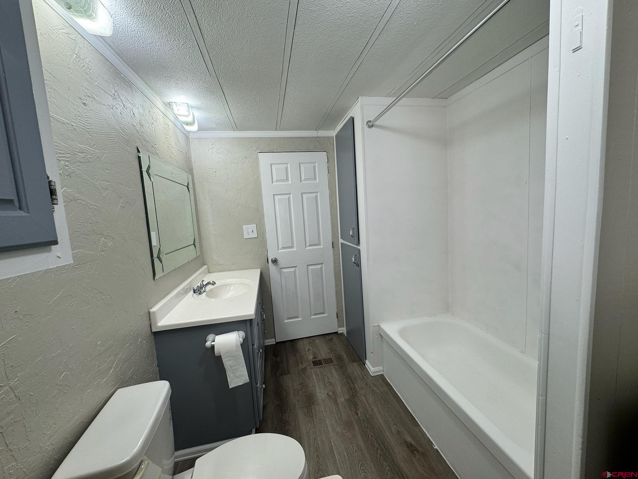 14555 Marine Road, Unit 328 Montrose, CO 81403 - Photo 16 of 20 a bathroom with a sink toilet and shower