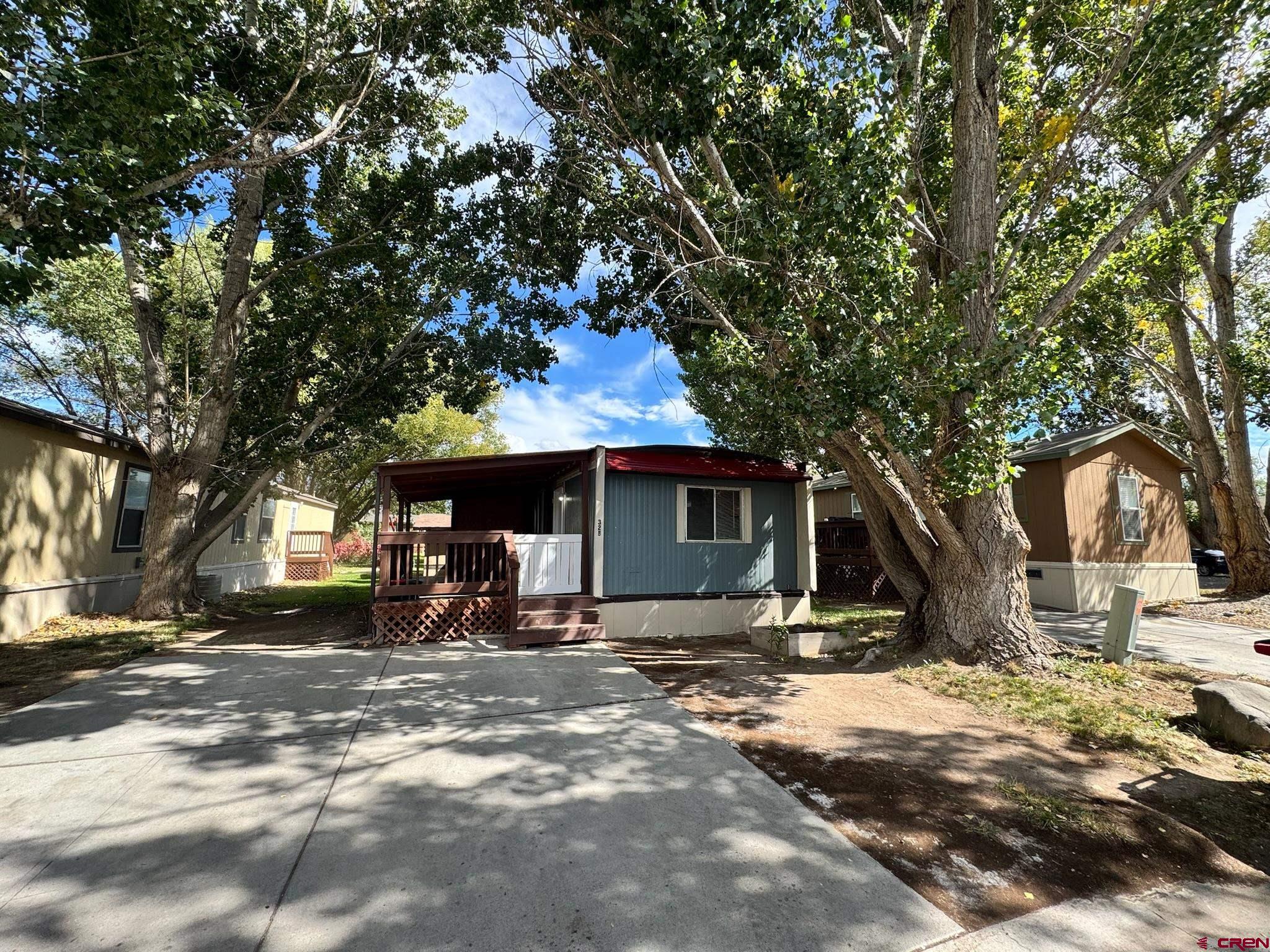14555 Marine Road, Unit 328 Montrose, CO 81403 - Photo 17 of 20 a view of a house with a yard
