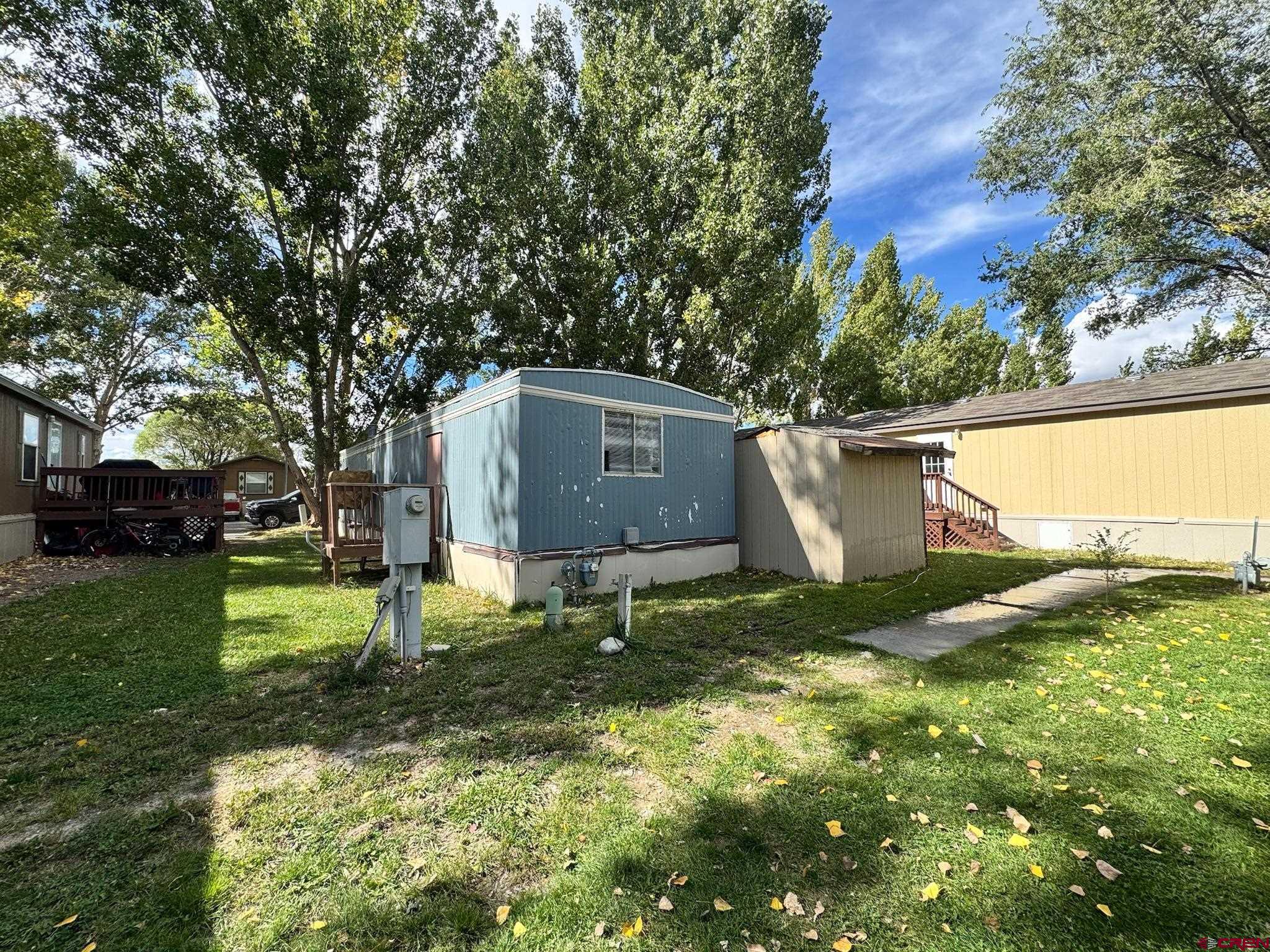 14555 Marine Road, Unit 328 Montrose, CO 81403 - Photo 20 of 20 a backyard of a house with lots of green space