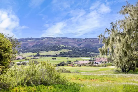 a view of a yard with an outdoor space and seating