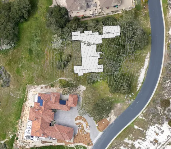 an aerial view of residential house with outdoor space
