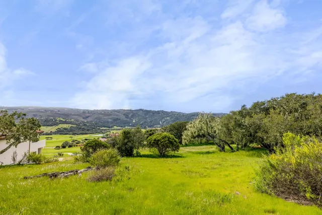 a view of a lake with mountains in the background