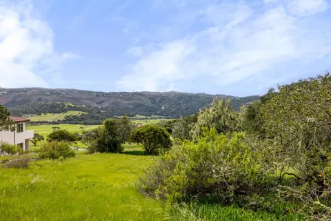 a view of a golf course with a lake