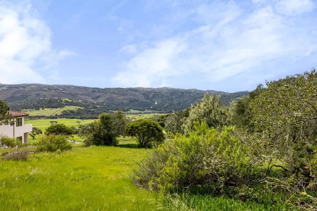 a view of a golf course with a lake