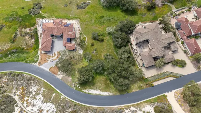 an aerial view of a residential apartment building with a swimming pool
