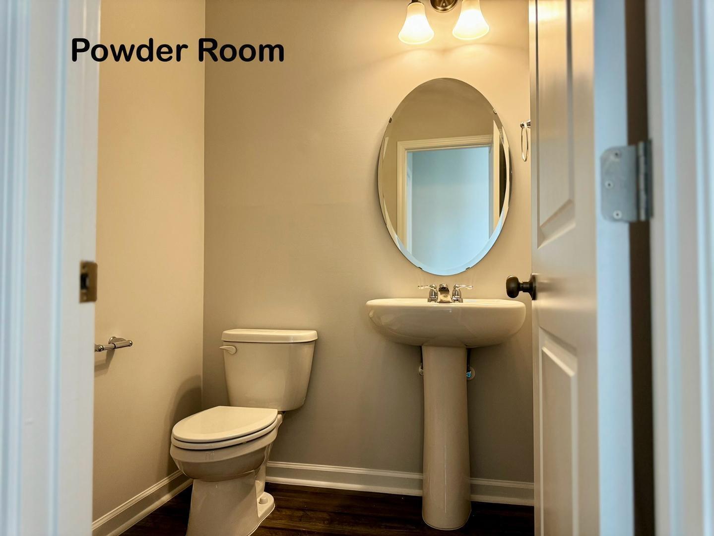 152 Sweet Lilac Way Raleigh, NC 27610 - Photo 15 of 40 a bathroom with a toilet sink and mirror