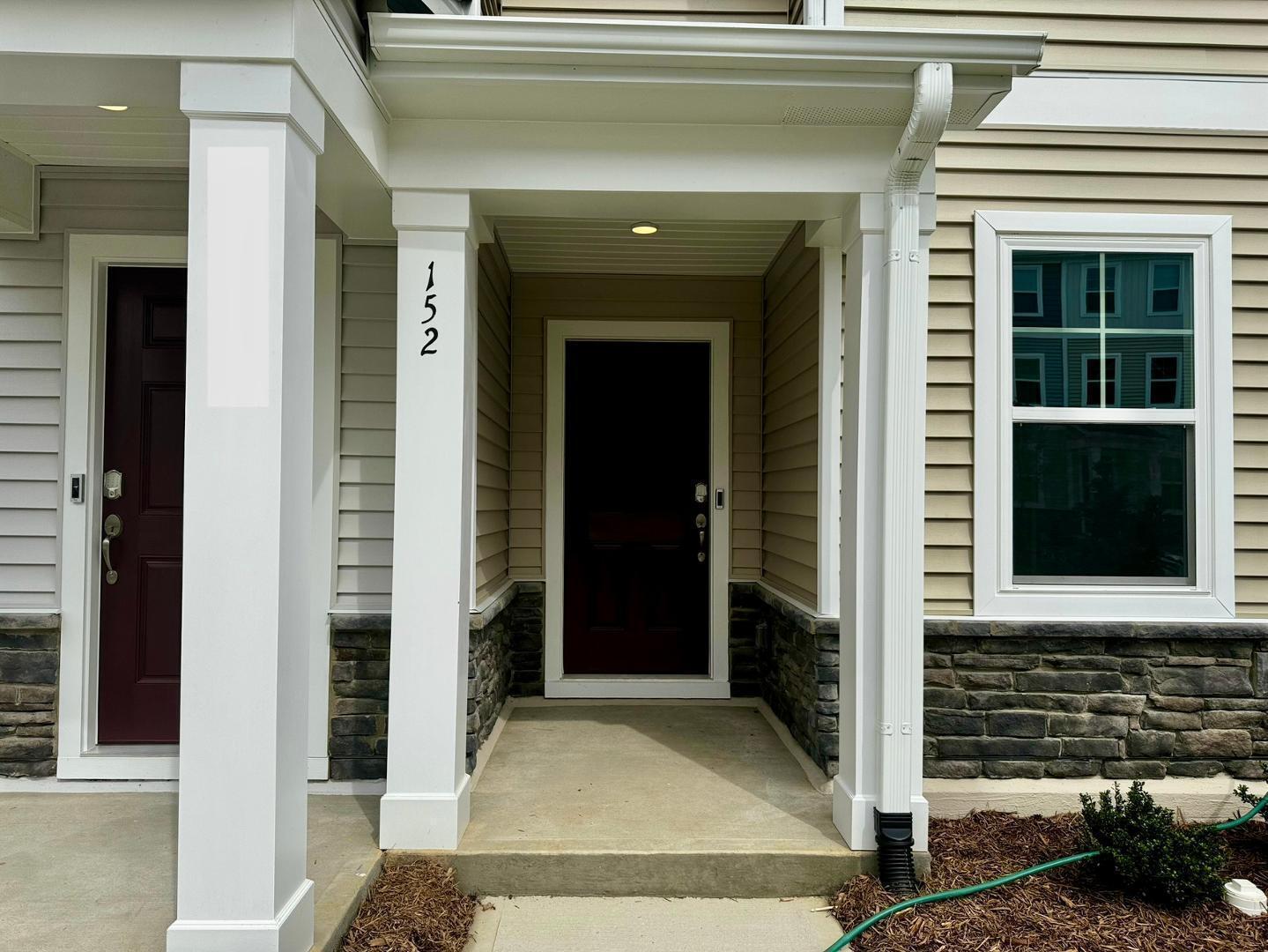 152 Sweet Lilac Way Raleigh, NC 27610 - Photo 3 of 40 a front view of a house with a entrance