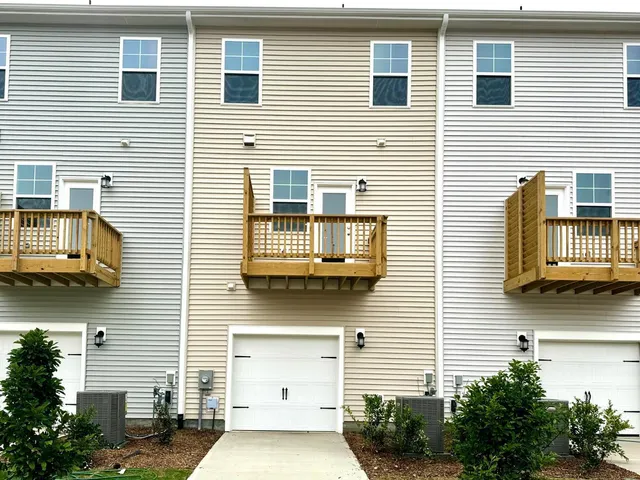 a front view of a building with many windows
