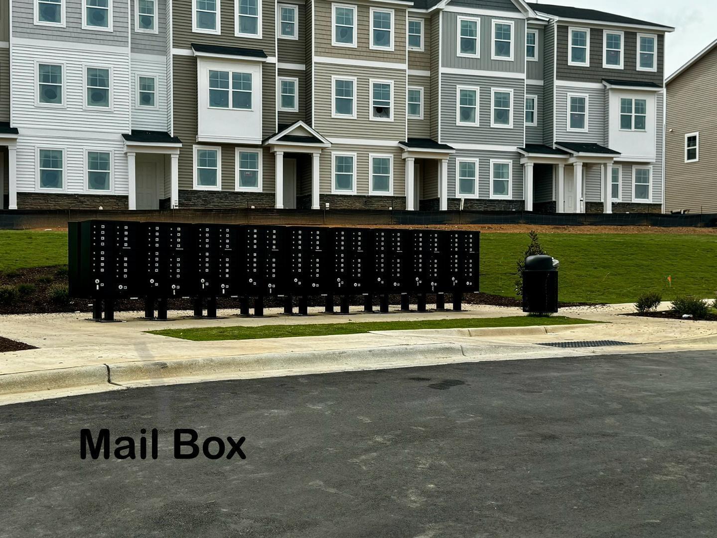 152 Sweet Lilac Way Raleigh, NC 27610 - Photo 38 of 40 a front view of a building with a street