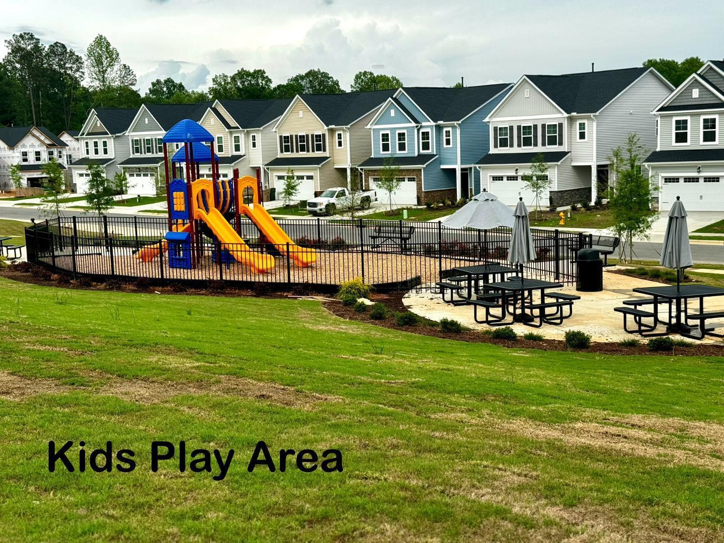 152 Sweet Lilac Way Raleigh, NC 27610 - Photo 39 of 40 a view of an house with outdoor space and seating area