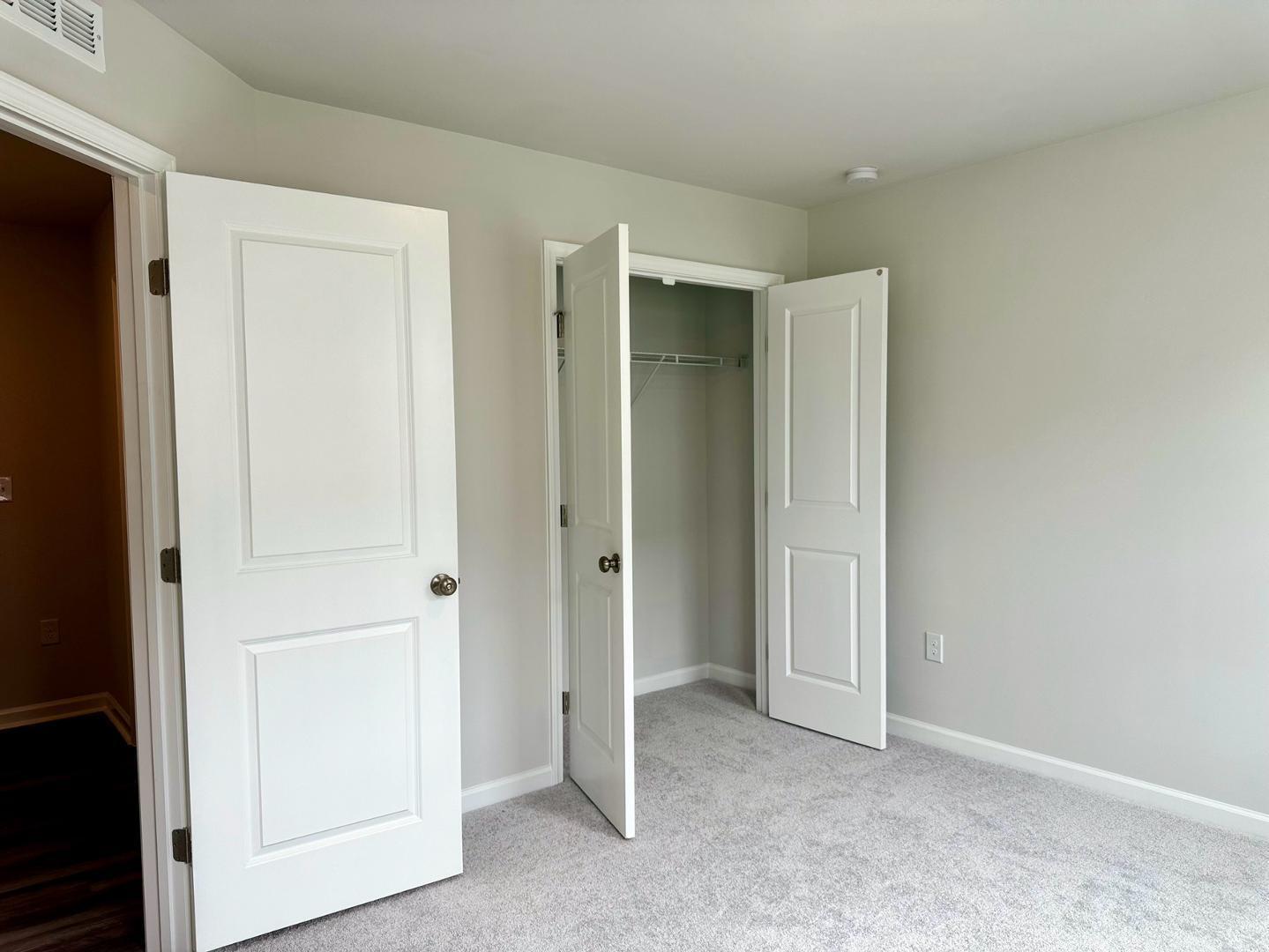 152 Sweet Lilac Way Raleigh, NC 27610 - Photo 6 of 40 a view of an empty room