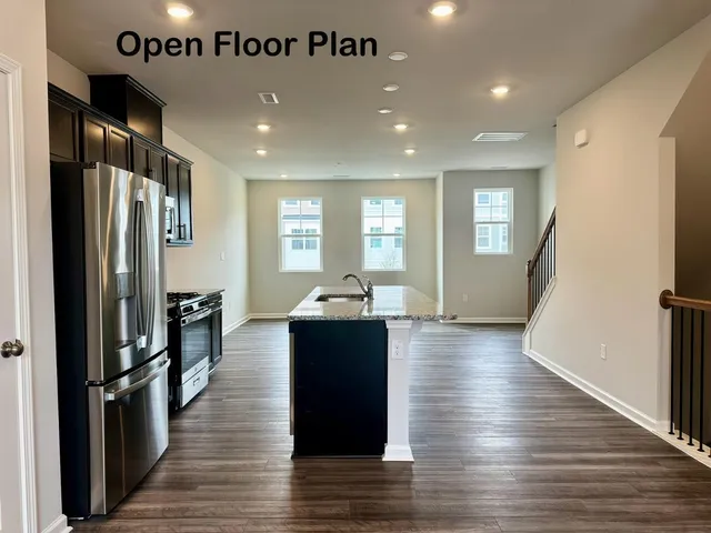 a kitchen with counter top space and refrigerator