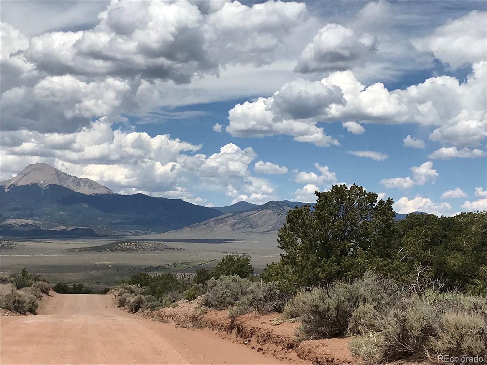 111 Scheffellin Road Fort Garland, CO 81133 - Photo 2 of 28 a view of a lake in middle of forest