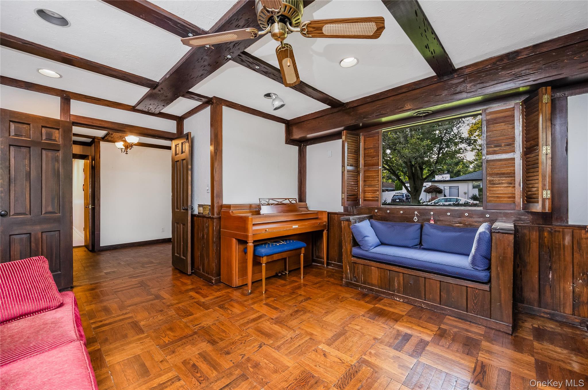 29 Randy Lane Plainview, NY 11803 - Photo 10 of 38 Wood-finish beamed ceiling, wood-finish flooring, wood-finish wall paneling, built-in shelving, and a built-in window seat. Potential 4th bedroom on main floor