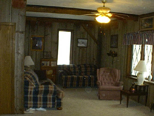 8577 West Winslow Road Durand, IL 61024 - Photo 6 of 6 a view of living room with furniture and chandelier
