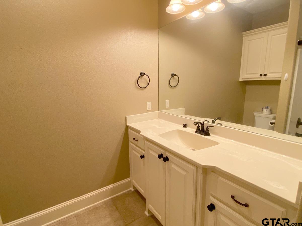 200 Water Street, Unit B Bullard, TX 75757 - Photo 11 of 14 a bathroom with a sink and a mirror