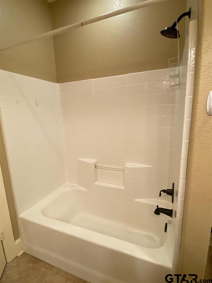 200 Water Street, Unit B Bullard, TX 75757 - Photo 12 of 14 a bathroom with a bathtub